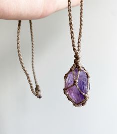 Discover our Crystal Healing Macrame necklace. AMETHYST is known for its calming, clarifying, and protective properties. It helps reduce stress, enhances mental clarity, and shields against negative energies. This beautiful purple crystal is also believed to promote spiritual growth and inner peace, immersing you in serene tranquillity. Spiritual Crystal Necklace On Waxed Cord As Gift, Spiritual Necklace With Adjustable Cord, Spiritual Crystal Necklace With Adjustable Cord As Gift, Spiritual Necklace With Adjustable Waxed Cord, Bohemian Crystal Necklace With Adjustable Waxed Cord, Handmade Crystal Necklace On Waxed Cord As Gift, Bohemian Crystal Pendant Necklace With Adjustable Cord, Holistic Jewelry With Adjustable Cord For Meditation, Bohemian Crystal Necklaces With Adjustable Cord For Healing