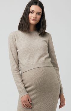 From work to the weekend, the Sandy Detachable Nursing Knit will be on high rotation! This versatile top features a removable under-layer, leaving a cute cropped knit - perfect for pairing with high waisted skirts, layering over dresses or wear as a set with the Dani Knit Skirt. Post-pregnancy the duo provides easy, discreet nursing access. Semi fitted Fully fashion knit with jersey underlayer Round neckline Detachable underlayer, can be worn under other garmentsSweater can be worn on its ownLon Fitted Knit Cropped Sweater For Layering, Fitted Cropped Sweater For Layering, Fitted Cropped Sweater In Soft Knit, Fitted Soft Knit Cropped Sweater, Fitted Neutral Sweater For Layering, Fitted Beige Cropped Sweater Chic Style, Fitted Cropped Knit Top For Layering, Chic Cropped Knit Top For Layering, Fitted Beige Knit Cropped Sweater