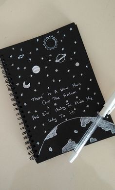 a notebook with writing on it next to a pen