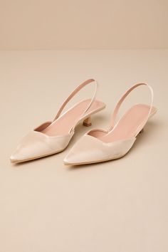 a pair of women's shoes on a white surface