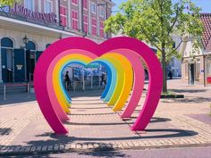 a large heart sculpture in the middle of a street