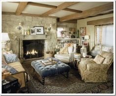 a living room filled with furniture and a fire place