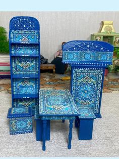 an assortment of blue furniture on display in a room