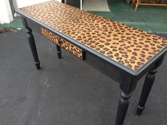 a black table with leopard print on it