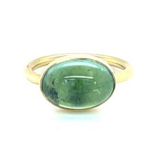 This one-of-a-kind Oval Cabochon Tourmaline Ring in 18KY is the perfect addition to compliment any ensemble. 18k yellow gold Green Tourmaline Cabochon Size 7 Designed and handcrafted in New Orleans Please note that due to the natural variations that can be found in gemstones, each stone's color may vary slightly from the images pictured. Please Note: All our pieces are handmade and unique. Color might vary from picture and piece to piece. Luxury Men's Oval Cabochon Engagement Ring, Bridal Jewels, Tourmaline Ring, Green Tourmaline, Oval Cabochon, Ring Necklace, Stone Color, New Orleans, Tourmaline