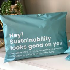 a blue bag with the words hey, sustainability looks good on you