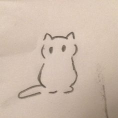 a drawing of a cat sitting on top of a white sheet with black ink in it