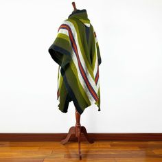 This is a brand new men's poncho, made of llama wool yarn. It is very light, soft, warm, very soft to touch and won't itch. One Size: 42 inch x 34 inch (106 x 86 cm) Important! Colours could differ slightly from the photo shown. Material: 100% Llama Wool Weight: 900 g Care: Hand Wash or Dry Use Mild Detergent Do not Bleach We ship directly from Ecuador. Sometimes delays may occur on customs due to random checking. Green One-size Winter Poncho, Green One Size Winter Poncho, Cozy One-size Green Poncho, Mens Poncho, Hooded Poncho, Boho Festival, Green And Khaki, South American, Alpaca Wool