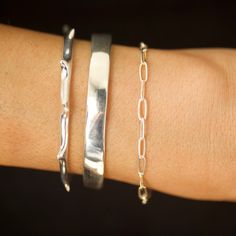 Includes 3 pieces: Spiky Cuff, Raw Flat Cuff, and Micro Rectangle Chain Bracelet Trio of our best selling silver bracelets. Sterling Silver. Lengths: Spiky Cuff: OS (adjustable) Raw Flat Cuff: XS/S or M/L Micro Rectangle Chain Bracelet: 7" XS/S approximately 5.5"- 6.5" wrist size M/L approximately 7"- 8" wrist size Hand sculpted and Reiki infused by Mara. All of MARA's Sets are 10% off total price. Bracelet Set Silver, Costume Necklaces, Silver Cuff, Ring Bracelet, Silver Bracelets, Bracelet Set, Chain Bracelet, Jewelry Care, Necklaces Bracelets