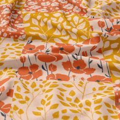 an orange and yellow floral print fabric