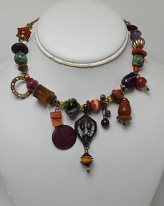 This great signed necklace by Treska is incredibly unique both in quality and appeal. It has tiered pendanta and great beadwork. It measures about 16" in total length with the center pendant measuring about 2 1/2" down. The beading covers about 9 1/2" along the necklace. It has no apparent damages or repairs Metal Necklace With Large Beads For Gift, Bohemian Metal Beaded Necklaces With Large Beads, Beaded Czech Glass Pendant Necklace, Unique Czech Glass Jewelry For Festival, Multicolor Czech Glass Necklace One Of A Kind, Handmade Bohemian Round Pendant Beads, Unique Adjustable Pendant Beaded Necklaces, Unique Adjustable Pendant Beaded Necklace, Spiritual Multi-strand Czech Glass Jewelry