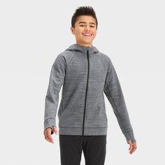 Why we're ALL IN: Premium fleece hoodie in a solid shade with a full-length zippered front and raglan long sleeves with thumbhole cuffs. Crafted from a lightweight cotton-polyester blend to keep your child feeling comfy and cozy. Tailored in a regular fit that hits below the hip and finished with functional pockets on the sides. All in Motion™: Made for every move, priced for every day. Athletic Heather Long Sleeve Fleece Activewear, Long Sleeve Fleece Activewear In Athletic Heather, Athletic Heather Long Sleeve Outerwear For Fall, Heather Grey Long Sleeve Sports Hoodie, Hooded Athletic Heather Activewear For Winter, Winter Athletic Heather Hooded Activewear, Boys Golf, Boy Activewear, Basic Sweatshirt