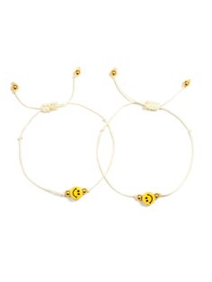 Show you care with the Happy For You Bracelet Set! This fun friendship set comes with two bracelets with happy face charms, sure to put a smile on you and your BFF's face (and wrists)! Set of two 5" Adjustable white thread bracelets (one for you, one for your bestie!) Drawstring closure (extendable up to 10") Gold plated brass hardware Ceramic charms Handmade in New York City and Puerto Rico. Due to the handmade nature of our products, some charms may vary in color and style or be replaced if un Venessa Arizaga, Bff Bracelets, Thrift Flip, Thread Bracelets, Star Bracelet, Smile On, Happy Face, Love Bracelets, The Happy