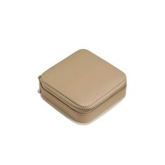 Beautiful and functional, this travel jewelry case is perfect for organizing your jewelry on the go! This case accommodates everything from rings and stud earrings to wide hoops, bracelets, and chain necklaces. The full-zip metal closure keeps your valuables safe and secure.Vegan LeatherSoft suede-like interior liningSize: 4 inches square x 1 3/8" highMetal Zip ClosureFour necklace/bracelet hooks with pocketSix earring holesRing holderClean with a dry cloth Travel Jewelry Storage Rectangular Case, Elegant Compact Jewelry Storage For Everyday Use, Classic Rectangular Jewelry Storage For Travel, Portable Gold Jewelry Storage For Travel, Elegant Compact Travel Jewelry, Elegant Gold Jewelry Storage For Travel, Compact Portable Jewelry Storage For Everyday, Elegant Gold Round Case Jewelry Storage, Beige Rectangular Jewelry Gift