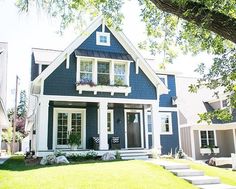 a blue and white house with steps leading up to it