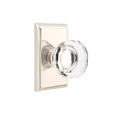 an image of a glass door knob on a white background with the handle in polished chrome