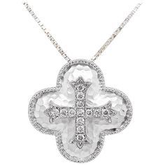 This gorgeous diamond cross pendant is a stunning and striking design. The cross pendant is made in 925 sterling silver with genuine, natural diamonds. The pendant was designed to be hammered with the diamond cross in the center. The metal is a unique, anti-tarnish sterling silver. This pendant is on an 18 inch cable chain that compliments the cross pendant perfectly. This necklace would make the perfect gift for your loved one or yourself! The details for this beautiful necklace are listed below: Metal Quality: 925 Sterling (anti-tarnish finish) Pendant Style: Cross Diamond Number: 13 Diamond Shape: Round Diamond Total Weight: .20 Carats Diamond Clarity: VS2 (Excellent, Eye Clean) Diamond Color: G (Excellent, Near Colorless) Diameter of Pendant: 20.96 millimeters Chain Type: Box Cable Cha Diamond Cross Necklace, Diamond Cross Pendants, Diamond Cross, Star Jewelry, Custom Jewelry Design, Cross Pendant Necklace, Drop Necklace, The Cross, White Gold Diamonds