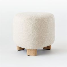 a white stool with wooden legs on a white background, it looks like something out of space