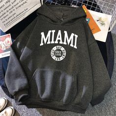 Stay warm and stylish in our Since 1896 Miami State Winter Hoodies. Durable and classic, these hoodies are perfect for the winter months and feature the classic Miami State logo. With warm knitted fabric, a drawstring hood, and ribbed detailing, comfort meets style for the ideal winter look. Designed by 4COLORDRESS Minimalist Winter, Winter Hoodie, Winter Hoodies, Street Outfit, Matches Fashion, Belleza Natural, Clothes Collection, Winter Looks, White Hoodie