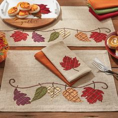 the placemats are decorated with autumn leaves