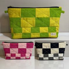 three small purses sitting on top of a counter next to each other in different colors