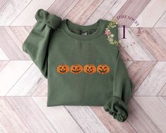 Embrace the Spirit of Spooky Season with Our Exquisite Embroidered Pumpkin Sweatshirt! 🎃🍂 As autumn leaves fall and Halloween approaches, there's no better way to celebrate than with our charming Embroidered Pumpkin Sweatshirt. This unique design captures the essence of fall with its meticulously crafted, high-quality thread embroidery. The embroidered pumpkin design measures a generous 1.6 x 6.8 inches, ensuring that every detail stands out beautifully. Why You'll Adore It: 🧵 Expert Craftsma Cavalier Spaniel, Pumpkin Sweatshirt, Halloween Crewneck, Pumpkin Sweatshirts, Halloween Sweater, Sweatshirt Halloween, Pumpkin Shirt, Pumpkin Faces, Bichon Frise