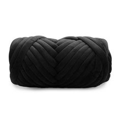 a black braided pillow on a white background