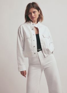 Enlist this oversized, military-inspired jacket into your wardrobe. The Nikki jacket is slightly cropped with patch pockets, stand up collar and a wide hem. The new comfort stretch denim has been stripped down and dyed to a milky white with natural texture and grit so the jacket keeps its structure but with a soft, worn-in touch.77% Cotton, 22% Lyocell, 1% SpandexCare Instructions:Machine wash cold gentle cycleLine dryZak is 5'8" wearing size Small White Shacket With Pockets For Work, White Outerwear With Patch Pockets For Work, Casual White Outerwear With Patch Pockets, White Winter Utility Jacket, White Utility Jacket For Winter, White Utility Jacket With Patch Pockets For Fall, White Utility Outerwear With Pockets, White Utility Jacket With Flap Pockets For Work, White Long Sleeve Utility Jacket With Patch Pockets