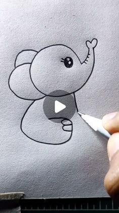 someone is drawing an elephant with a marker