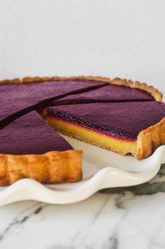 a pie on a plate with one slice cut out and the rest in the cake dish