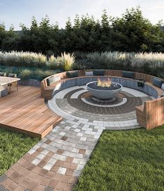 an outdoor fire pit surrounded by wooden benches and seating around it in the middle of a grassy area