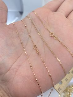 Solid 10K White Gold Rope Chain. This classic Rose Gold Gold Necklace is a must have in your jewelry collection. Makes an amazing Christmas gift for anyone. Layer perfectly with other necklaces. Premium Lobster Hook for added safety! Details: * Material: 10K Rose Gold * Pattern: Rope, Flat Mariner, Ball Station * Length: 16in, 18in 20in Rope Chain Width: 2mm Ball Chain Width: 1.8mm(ball) 1mm(Chain) Mariner : 1.3mm Arrives in a GIFT BOX and includes FREE SHIPPING within the USA. International Shi Dainty Rose Gold Jewelry With Curb Chain, Dainty Rose Gold Necklace With Curb Chain, Dainty Gold Chain, Dainty Chain Necklace, Gold Rope Chains, Rose Gold Chain, Sell Gold, Gold Pattern, Jewelry Business