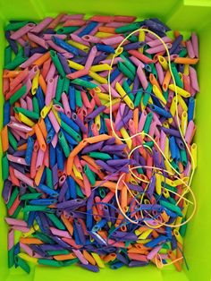 a box filled with lots of different colored sprinkles