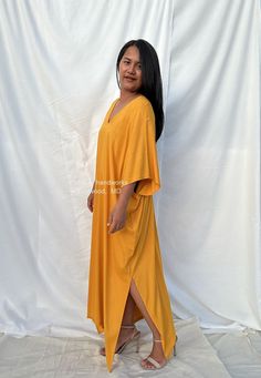 Celebrate your curves with our plus size kaftan dress. Created to embrace all body types, this kaftan is designed with care and style in mind. Its loose, flowing silhouette complements your figure while offering unbeatable comfort. The perfect choice for a night on the town or lounging at home. Casual Oversized Maxi Dress With Kimono Sleeves, Flowy Lounge Tunic With Kimono Sleeves, Flowy Maxi Tunic For Loungewear, Flowy Maxi Length Tunic For Loungewear, Loose Fit Tunic Midi Dress For Beach, Flowy Kimono Sleeve Tunic For Loungewear, Oversized Tunic Midi Dress For Beach, Maxi Length Kaftan With Side Slits, Oversized Maxi Dress For Loungewear