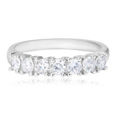 a white gold ring with five stones on the side and three rows of diamonds in the middle