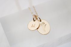 Surprise your loved one with our Birth Flower Necklace! Each delicate necklace is adorned with their special birth flower and comes with a personalized initial disc. Perfect for birthdays or as a thoughtful bridesmaids gift. Available in 14k gold filled or sterling silver. Comes with a beautiful printed card revealing the unique meaning behind each flower. D E T A I L S 14k Gold Filled or Sterling Silver Oval Measures 1/2" and Tiny Initial Charm Measures 3/8" Includes adjustable 16-18" Dainty Cable Chain Stamped by Hand Hypoallergenic and Nickel Free Handcrafted in Ohio Elegant Birth Flower Charm Necklaces For Personalized Gift, Elegant Charm Necklaces With Birth Flower For Personalized Gift, Delicate Yellow Gold Birth Flower Charm Necklaces, Delicate Yellow Gold Charm Necklace With Birth Flower, Delicate Yellow Gold Birth Flower Charm Necklace, Elegant 14k Gold Birth Flower Charm Necklace, Delicate Birth Flower Charm Necklace For Wedding, Minimalist Wedding Charm Necklace With Flower Charm, Minimalist Wedding Flower Charm Necklace