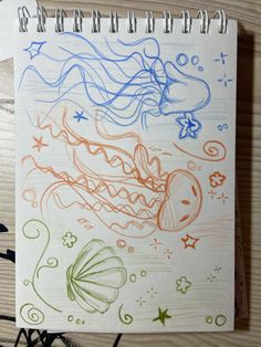 a notebook with some drawings on it