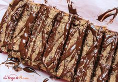 a close up of a piece of food with chocolate drizzled on it