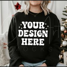 Embrace the holiday season with our Christmas Black Crewneck Mockup! Showcasing the popular Gildan 18000 Black Sweatshirt, this high-quality digital mockup is ideal for displaying your festive designs. Perfect for both personal and business use, this blank sweatshirt mockup provides a professional platform to highlight your Christmas and holiday-themed graphics. The sleek black background emphasizes your designs, ensuring they capture attention and stand out. Featuring a woman model wearing the Blank Sweatshirts, Black Crewneck, Professional Look, Holiday Outfits, Design Store, Black Backgrounds, Mockup, Sweat Shirt, Crew Neck