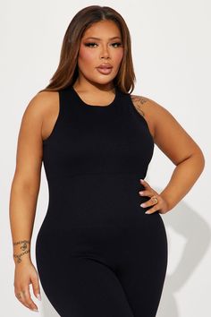 Available In Black, Charcoal, And Sand. Active Jumpsuit Seamless Ribbed Crew Neck Sleeveless Back Cut Out Skinny Leg Stretch 92% Nylon 8% Elastane Imported | Effortless Kim Ribbed Seamless Jumpsuit in Black size Large by Fashion Nova Fitted Black Ribbed Jumpsuit, Fitted Full-length Solid Unitard, Fitted Full-length Black Unitard, Seamless Jumpsuit, Black Athleisure Jumpsuit With Built-in Bra, Stretch Ribbed V-neck Jumpsuits And Rompers, Leg Stretching, Black Jumpsuit, Black Charcoal