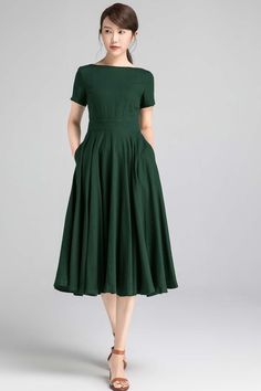 Cotton A-line Midi Dress For Garden Party, 1950s Style Fit And Flare A-line Vintage Dress, Elegant Cotton A-line Vintage Dress, 1950s Style A-line Pleated Dress, Cotton A-line Dress With Pleated Waist, Cotton A-line Fit And Flare Midi Dress, 1950s Style A-line Dress With Box Pleat, Solid Color A-line Retro Vintage Dress, Solid Color Retro A-line Vintage Dress