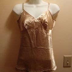 Beautiful Beige/Shell Colored Satin Cami With Adjustable Spaghetti Straps & Lots Of Dainty Embroidery On The Bodice & Hemline - Great Piece Under A Business Jacket Or With A Black Skirt - No Tags But Never Worn Elegant Gold Camisole For Spring, Fitted Gold Camisole For Spring, Elegant Fitted Gold Camisole, Elegant Gold Camisole, Beige Delicate Straps Camisole, Beige Strappy Camisole Top, Coquette Sleeveless Satin Camisole, V-neck Satin Camisole With Lace Trim, Beige Lace Trim V-neck Camisole