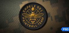 a black and gold patch with a bee on it