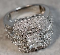 a diamond ring sitting on top of a table