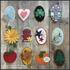 many different decorated cookies on a wooden table