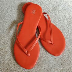 Brand New. Bright Orange. Wonderful With A Dress Or Jeans. You Can't Go Wrong With This Attractive Feminine Color. These Gems Need To Find A New Owner And Place. Cleaning Out My Closet. Buy Soon! Orange Open Toe Flip Flops For Summer, Summer T-strap Flip Flops For Vacation, T-strap Flip Flops For Beach Season Vacation, T-strap Flip Flops For Beach Vacation, Trendy T-strap Flip Flops For Summer, Orange Synthetic Flip Flops For Summer, Orange Flat Flip Flops For Summer, Orange Flip Flops For Beach Season, Summer Orange Flip Flops For Beach