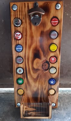 a wooden vending machine with many different types of buttons on it