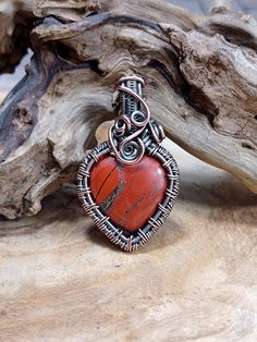 A double sided natural red jasper heart in a hand woven solid copper setting. Oxidized and polished for an antique finish. Matching chains and leather straps are available separately in my shop. Unique Copper Heart Pendant Necklaces, Copper Heart Pendant For Jewelry Making, Unique Copper Heart Pendant Necklace, Unique Copper Necklace With Heart Pendant, Red Wire Wrapped Copper Jewelry, Red Copper Wire Wrapped Jewelry, Handmade Copper Heart Pendant Necklace, Handmade Copper Heart Necklaces, Handmade Heart-shaped Copper Necklaces