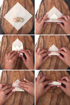 how to fold napkins on a wooden table with white paper and black nail polish