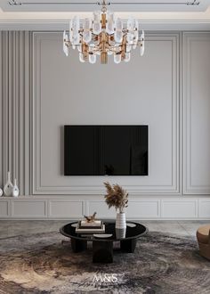 an elegant living room with chandelier and black table in front of the tv